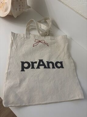 Prana Cream Canvas Tote with Black Logo and Red Bow Accent